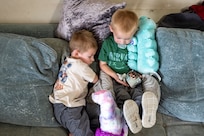 Tech. Sgt. Megan Brasley, a deployed aircraft vehicle data operations specialist originally assigned to the 124th Maintenance Group, Idaho Air National Guard, FaceTimes with her sons, Ryker and Rhett while deployed in support of overseas operations, April 7, 2025.