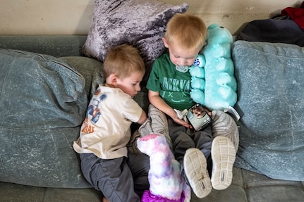 Tech. Sgt. Megan Brasley, a deployed aircraft vehicle data operations specialist originally assigned to the 124th Maintenance Group, Idaho Air National Guard, FaceTimes with her sons, Ryker and Rhett while deployed in support of overseas operations, April 7, 2025.