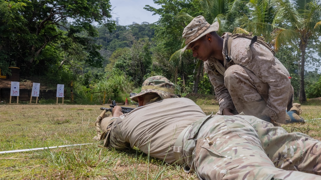 U.S. Marine Corps Lance Cpl. Jose Santosfanini, a Brooklyn, New York native and grenadier  with 1st Battalion, 8th Marines, 6th Regiment, 2d Marine Division advises a Panamanian security force member on how to zero his rifle in Horoko, Panama, April 19, 2025. U.S. Southern Command is focused on increasing partner nation capacity and interoperability in the region and reflects the United States’ enduring promise of friendship, partnership, and solidarity with the Panamanian people. (U.S. Marine Corps photo by Lance Cpl. Francis Hrosar)