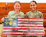 Master Sgt. Jennifer Dorsey (left) with her daughter, Sgt. Lydia Dorsey at the master sergeant’s retirement ceremony.