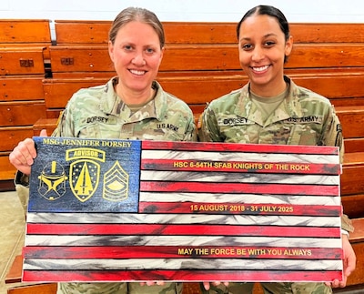 Master Sgt. Jennifer Dorsey (left) with her daughter, Sgt. Lydia Dorsey at the master sergeant’s retirement ceremony.