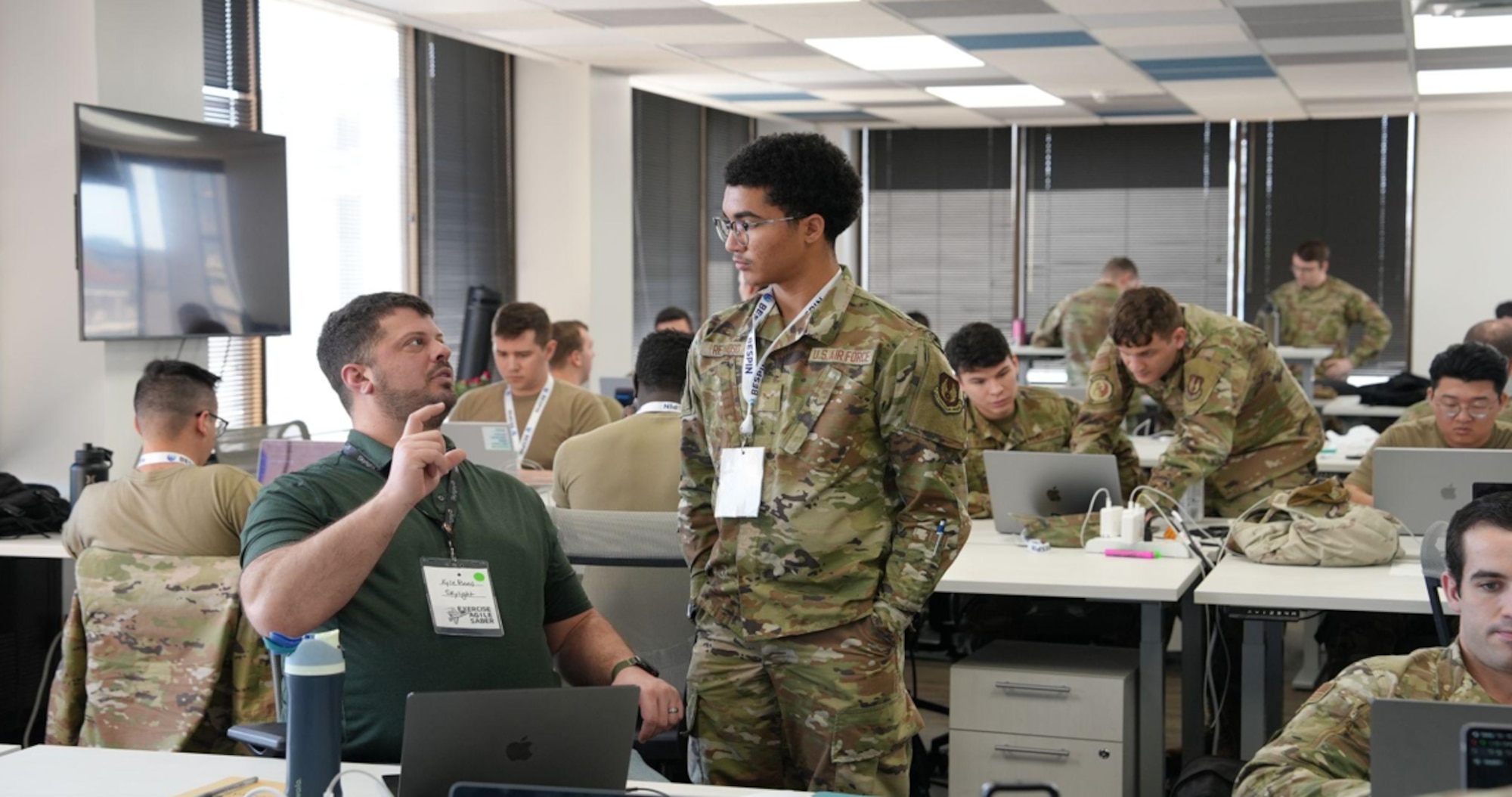 BESPIN industry partner, Kyle Bond, collaborates with Airmen Reynoso