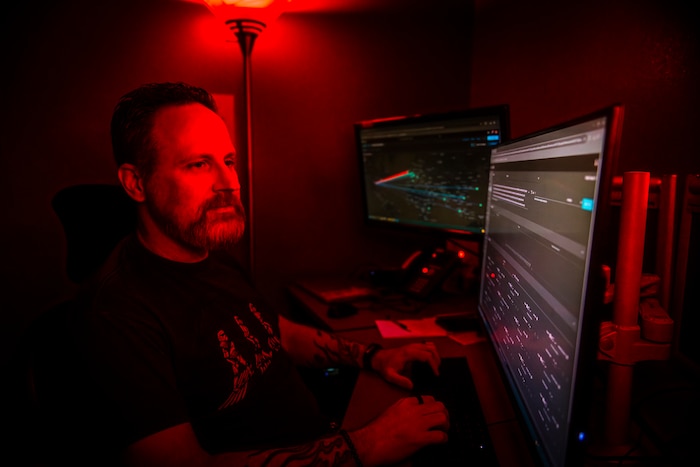 Lonnie Dierkson, 412th Communications Squadron, REDCORE operations lead cyber defense operator, demonstrates his team's counter-cyber-attack capabilities on Edwards Air Force Base, California, recently. The Research, Development, Test & Enterprise Defensive Cyber Operations Response Element (REDCORE) provides continuous cyber defense for 412th Test Wing and Air Force Test Center assets on Edwards (Air Force photo by Giancarlo Casem).