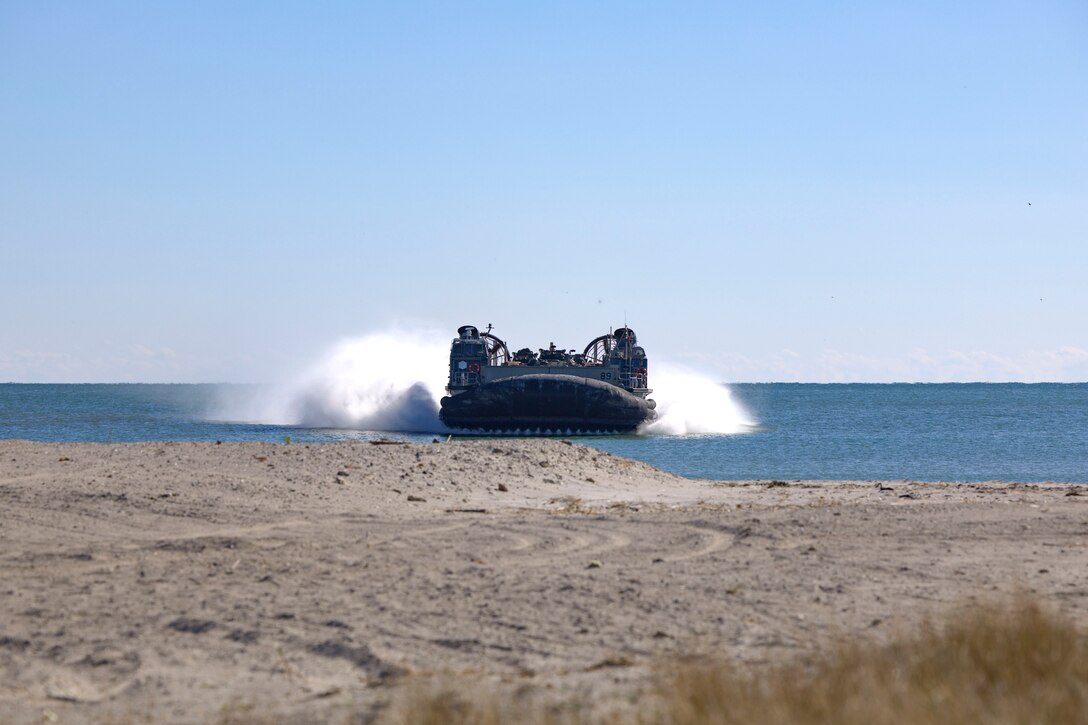 A U.S. Navy Landing Craft Air Cushion carries Marines with the 24th Marine Expeditionary Unit (Special Operations Capable) to shore on Onslow Beach, North Carolina, Dec. 2, 2024. The Marines with the 24th MEU (SOC) return to Camp Lejeune following a 7-month long deployment to U.S. Naval Forces Europe and Africa area of operation. Embarked on the Navy’s Wasp Amphibious Ready Group, the 24th MEU (SOC) supported U.S. Allied, and partner interests in the region, including the Eastern Mediterranean Sea, to promote regional stability and deter aggression. (U.S. Marine Corps photo by Sgt. Michele Clarke)