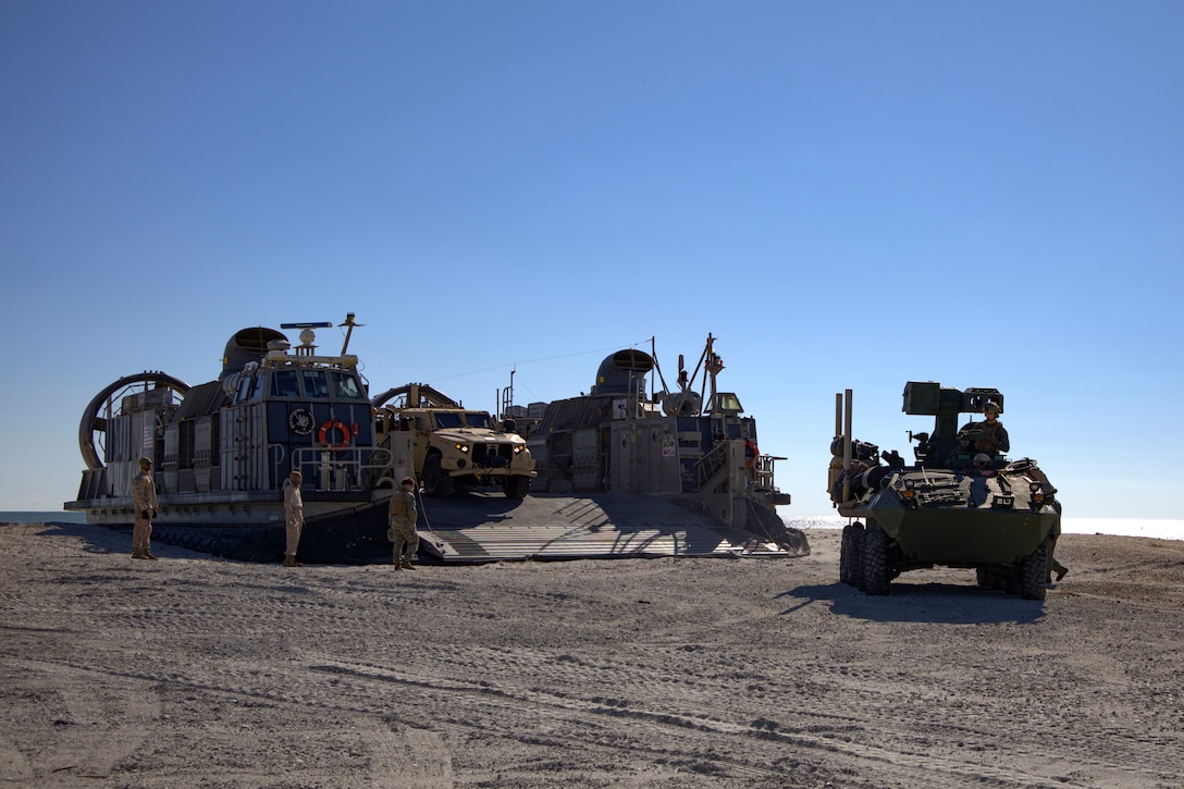U.S. Marines with the 24th Marine Expeditionary Unit (Special Operations Capable) off load vehicles from a Navy Landing Craft Air Cushion on Onslow Beach, North Carolina, Dec. 2, 2024. The Marines with the 24th MEU (SOC) return to Camp Lejeune following a 7-month long deployment to U.S. Naval Forces Europe and Africa area of operation. Embarked on the Navy’s Wasp Amphibious Ready Group, the 24th MEU (SOC) supported U.S. Allied, and partner interests in the region, including the Eastern Mediterranean Sea, to promote regional stability and deter aggression. (U.S. Marine Corps photo by Sgt. Michele Clarke)