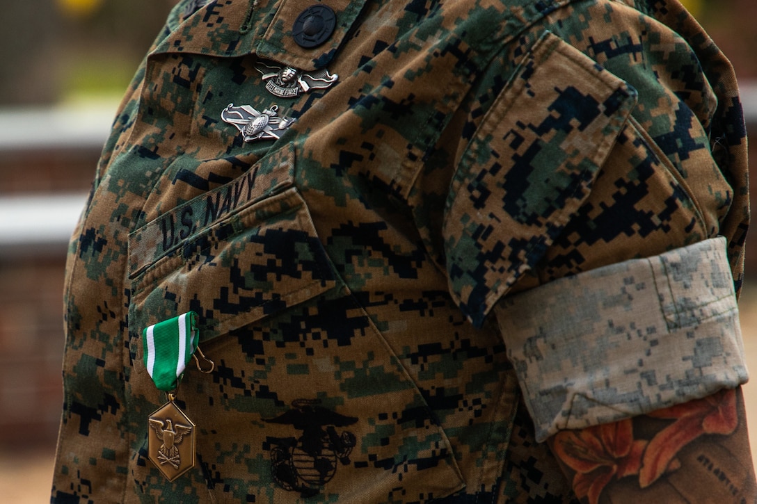 U.S Navy Petty Officer First Class Nancy Guillermo, a Queens, New York native with the 24th Marine Expeditionary Unit (MEU), is awarded a Navy and Marine Corps Commendation Medal at the Lejeune Memorial Gardens, Jacksonville, N.C., March 24, 2025. As the 24th MEU’s Religious Programs Specialist, Guillermo organized and participated in multiple volunteer opportunities and community relation events during the pre-deployment training cycle and deployment. (U.S. Marine Corps photo by Cpl. Victoria Hutt)