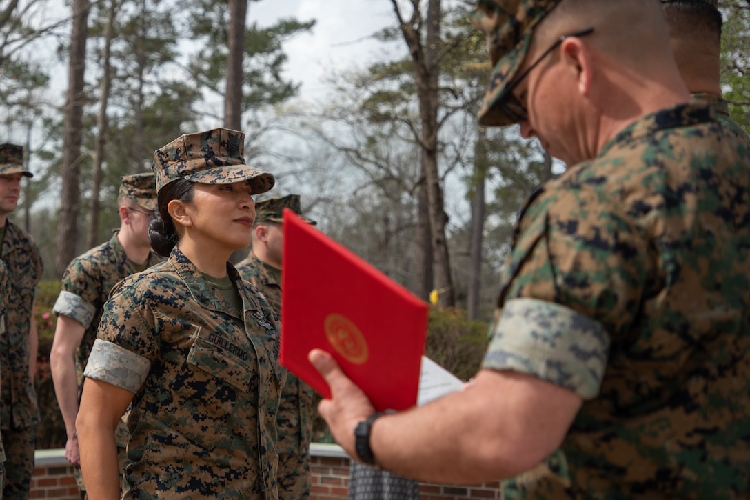 U.S Navy Petty Officer First Class Nancy Guillermo, a Queens, New York native with the 24th Marine Expeditionary Unit (MEU), is awarded a Navy and Marine Corps Commendation Medal at the Lejeune Memorial Gardens, Jacksonville, N.C., March 24, 2025. As the 24th MEU’s Religious Programs Specialist, Guillermo organized and participated in multiple volunteer opportunities and community relation events during the pre-deployment training cycle and deployment. (U.S. Marine Corps photo by Cpl. Victoria Hutt)