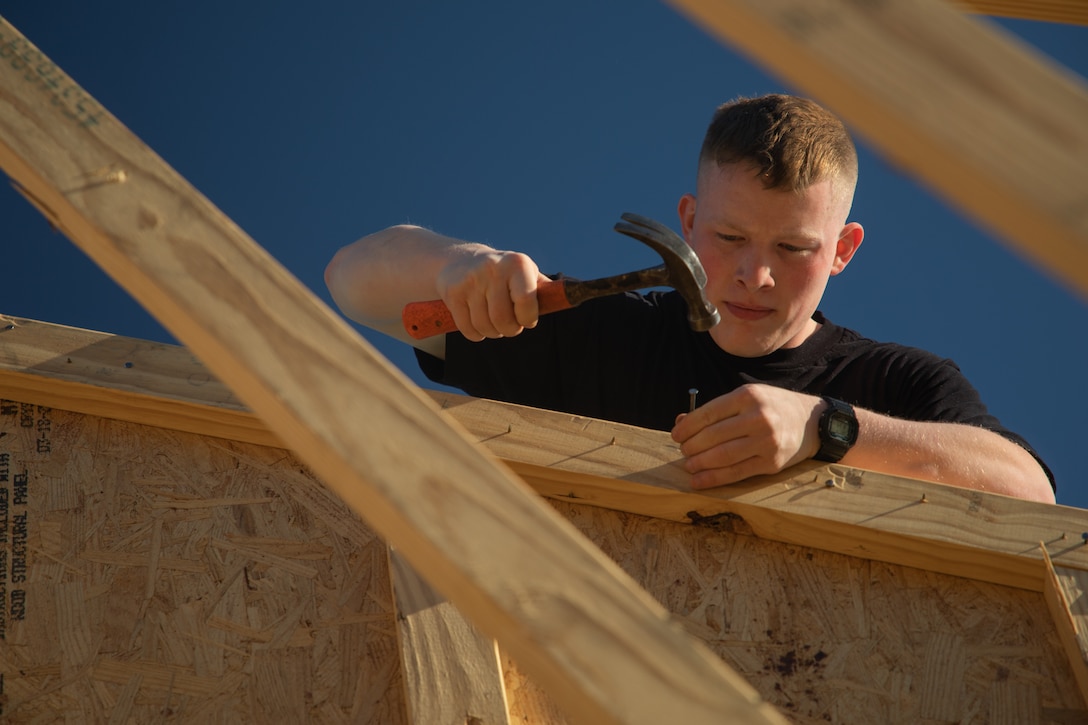 U.S. Marine Lance Cpl. John Bechtold, an intelligence specialist with the 24th Marine Expeditionary Unit (MEU), volunteers with the Habitat for Humanity foundation in Wilmington, N.C., April 16, 2025. 24th MEU Marines and Sailors volunteer with different organizations to give back to local communities and build relationships. (U.S. Marine Corps photo by Cpl. Victoria Hutt)