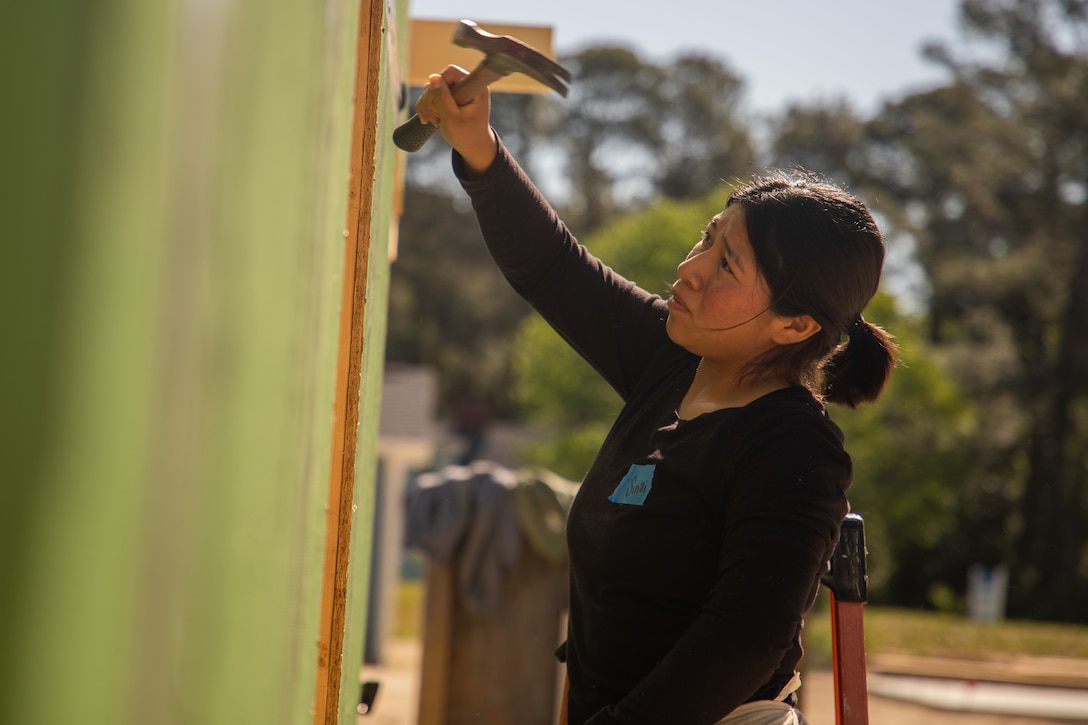 U.S. Marine Pfc. Sinai Garcia-Bello, an inventory management specialist with the 24th Marine Expeditionary Unit (MEU), volunteers with the Habitat for Humanity foundation in Wilmington, N.C., April 16, 2025. 24th MEU Marines and Sailors volunteer with different organizations to give back to local communities and build relationships. (U.S. Marine Corps photo by Cpl. Victoria Hutt)