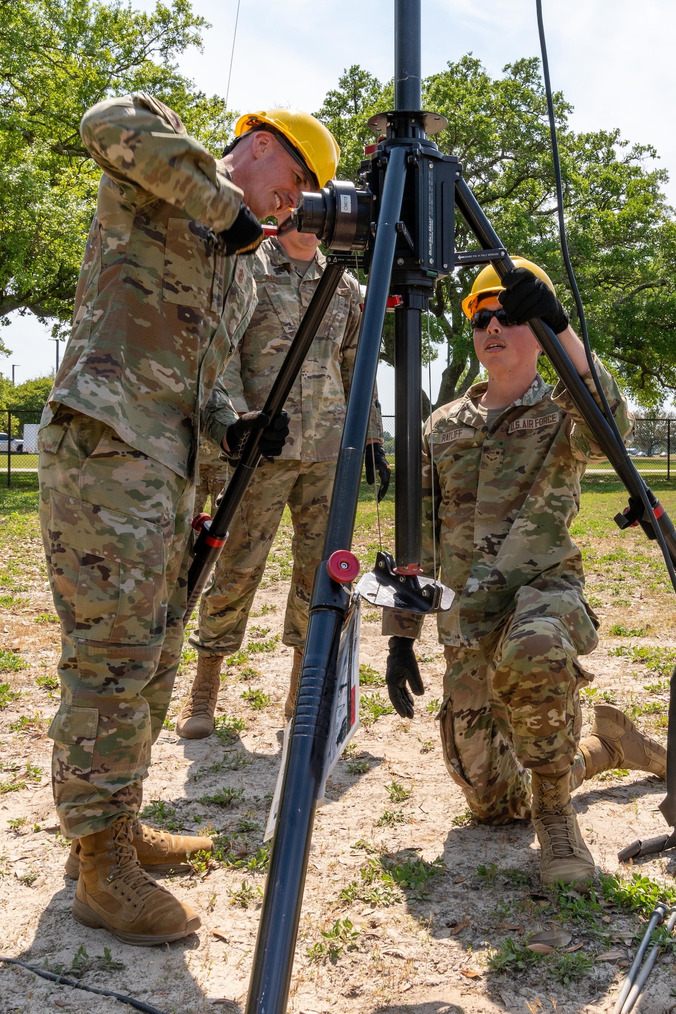 Airmen setting up a radio tower.