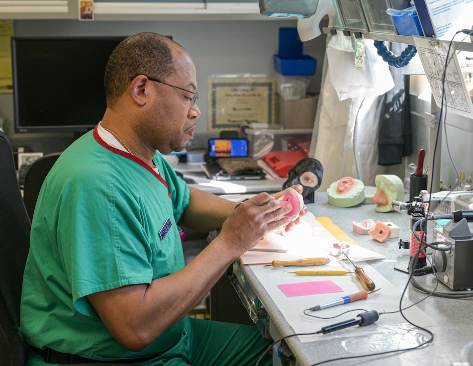Medical professional making a mold.