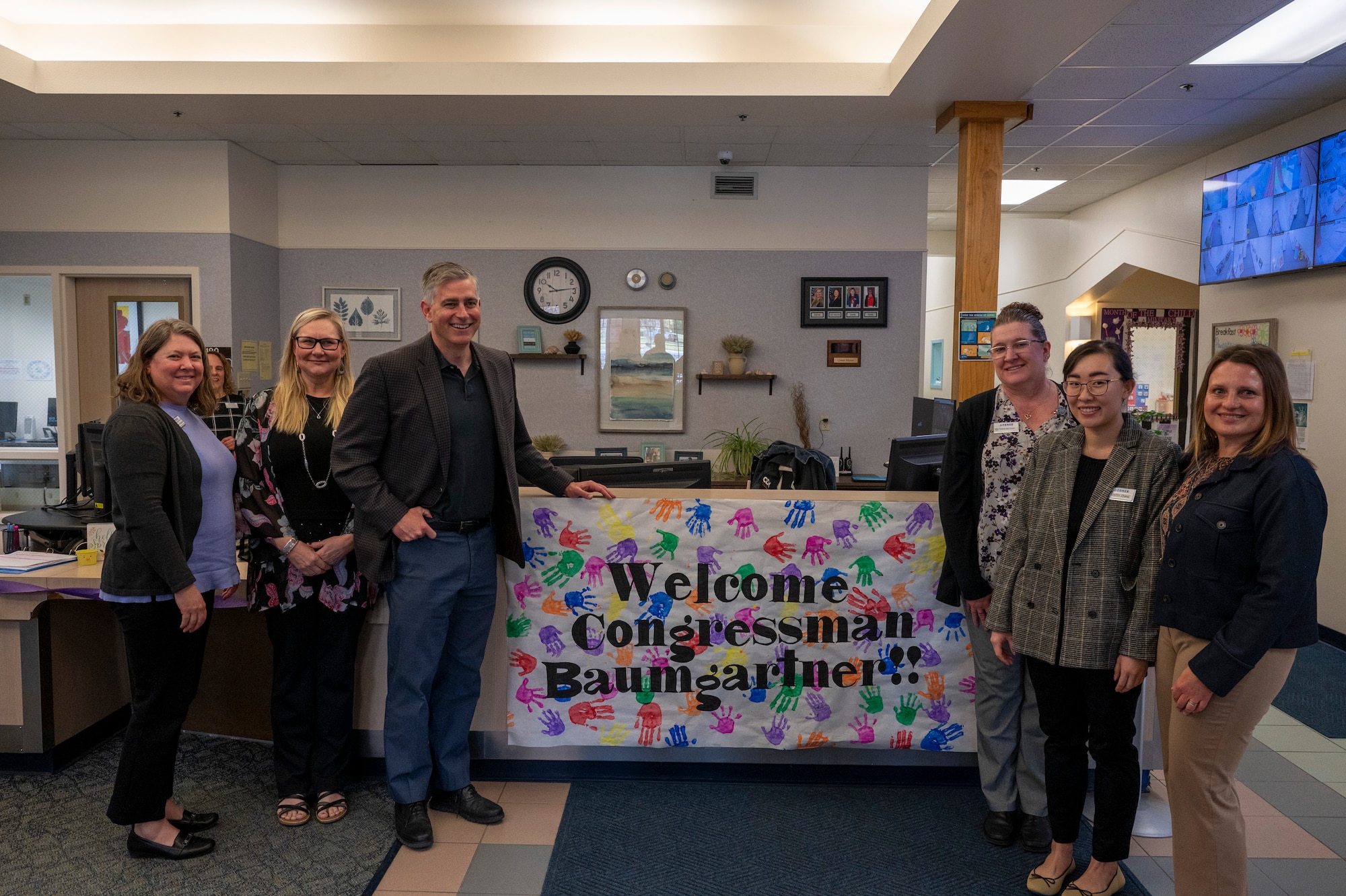 U.S. Rep Michael Baumgartner poses for a photo with staff at the Child Development Center during a visit to Fairchild Air Force Base, Washington, April 24, 2025. During his tour, he visited the CDC, Air Traffic Control Tower and Wing Headquarters. Various topics were covered to include: funding, facilities, land use agreements and the Survival, Evasion, Resistance, and Escape mission. (U.S. Air Force photo by Airman 1st Class Samantha Thorn)