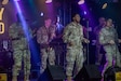 U.S. Army Soldiers from the 8th Army Rock Band perform for a crowd at the annual car and bike show, on Camp Humphreys, South Korea, March 29, 2025. The band was a part of the annual car and bike show held for owners to show off their vehicles, as well as to give the community a chance to view a wide variety of vehicles and listen to live music. (U.S. Army photo by Pfc. Seu Chan)