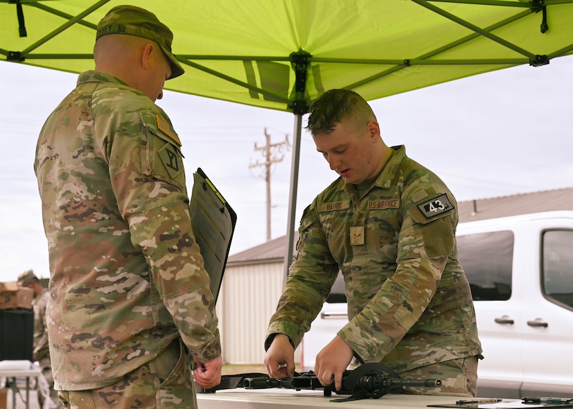 U.S. Air Force Airman 1st Class Elijah Harris, 104th Fighter Wing (FW) public affairs specialist, clears his weapon during the Massachusetts National Guard 2025 Best Warrior Competition, Camp Edwards, Massachusetts, April 11, 2025. Harris represented the 104th FW while competing against members of the Air and Army National Guard, Kenya Defense Forces and Irish Defense Forces. (U.S. Air National Guard Photo by Melanie J. Casineau)