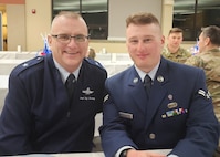 Brigadier General Joseph Morrisey jr., Chief of Staff and Air Component Commander Massachusetts Air National Guard and Airman 1st Class Elijah Harris, 104th Fighter Wing (FW) public affairs specialist, poses for a photo during the Massachusetts National Guard 2025 Best Warrior Competition, Camp Edwards, Massachusetts, April 6, 2025. Harris represented the 104th FW while competing against members of the Air and Army National Guard, Kenya Defense Forces and Irish Defense Forces. (U.S. Air National Guard Photo by Melanie J. Casineau)