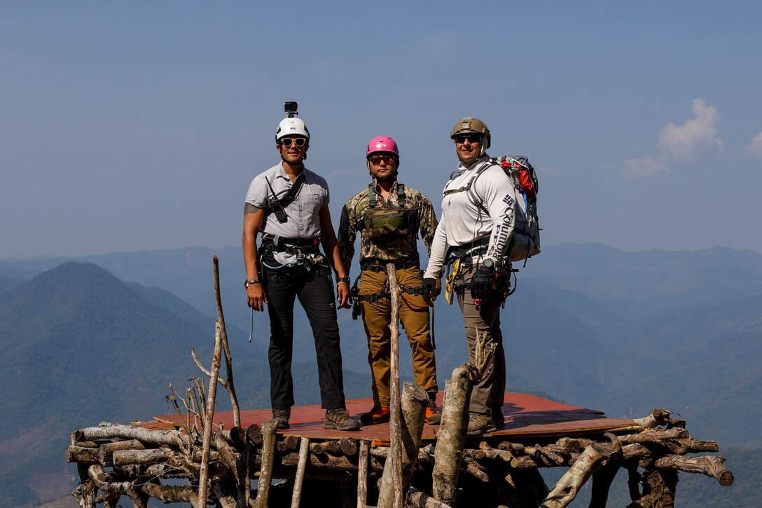 rom left, U.S. Army Staff Sgt. Miguel Navarra, a medic, U.S. Air Force Tech Sgt. Joshua Pyo, an mountaineer, and U.S. Navy Chief Petty Officer Erik Muniz, an explosive ordnance disposal technician, all with Defense POW/MIA Accounting Agency, pose for a photo during a recovery mission in Laos, Mar. 2, 2025.