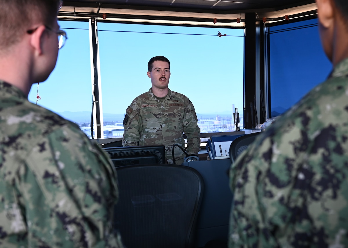 U.S. Air Force Staff Sgt. Michael Hollingsworth, 355th Operational Support Squadron watch tower supervisor, briefs University of Arizona’s U.S. Naval Reserve Officer Training Corps cadets at Davis-Monthan Air Force Base, Arizona, April 26, 2025. The NROTC cadets were focused on careers in aviation and toured the Air Traffic Control Tower to learn more about airfield management. (U.S. Air Force photo by Staff Sgt. Abbey Rieves)