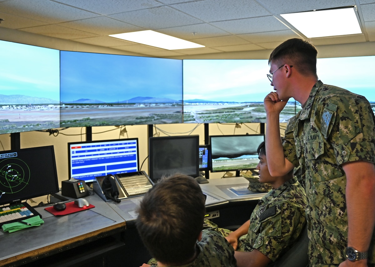 University of Arizona’s U.S. Naval Reserve Officer Training Corps cadets test an airfield simulator at Davis-Monthan Air Force Base, Arizona, April 26, 2025. The cadets toured the Air Traffic Control Tower to broaden aviation perspectives and learn more about the operational military. (U.S. Air Force photo by Staff Sgt. Abbey Rieves)