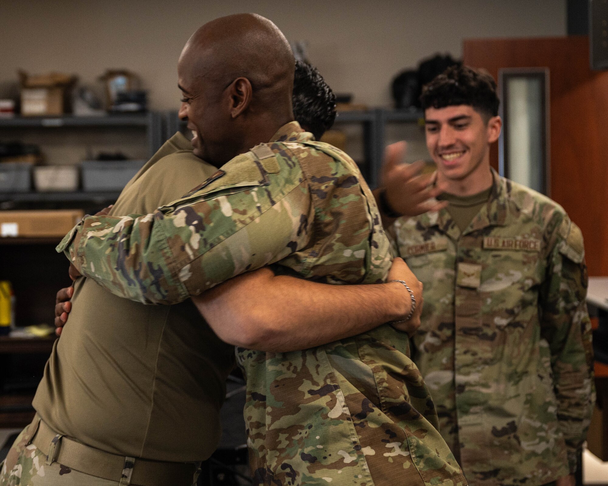 U.S. Air Force Chief Master Sgt. Leray Smedley, 13th Combat Air Base Squadron senior enlisted leader, hugs his fellow Airman, April 28, 2025, at Luke Air Force Base, Arizona.