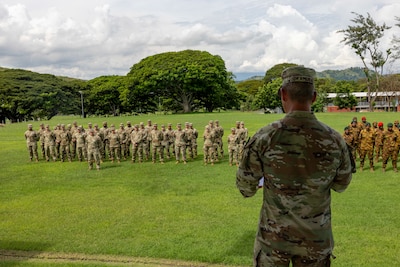 U.S. Army Maj. Gen. Lance Okamura, U.S. Army Pacific - Homeland Affairs, deputy commanding general, and Brig. Gen. Larry Opa, deputy commander of the Papua New Guinea Defense Force, gives a speech during the closing ceremony of Tamiok Strike 2025 in Port Moresby, Papua New Guinea, April 25, 2025.