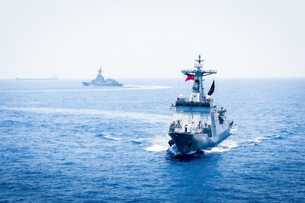 U.S. Marine Corps and U.S. Air Force aircraft, off frame, integrate with the Philippine Navy Jose Rizal-class guided-missile destroyer BRP Antonio Luna (FF151), right, and the Royal Australian Navy Hobart-class guided-missile destroyer HMAS Sydney (DDG 42), center, to conduct a multilateral Maritime Cooperative Activity within the Philippines’ Exclusive Economic Zone, April 29, 2025.