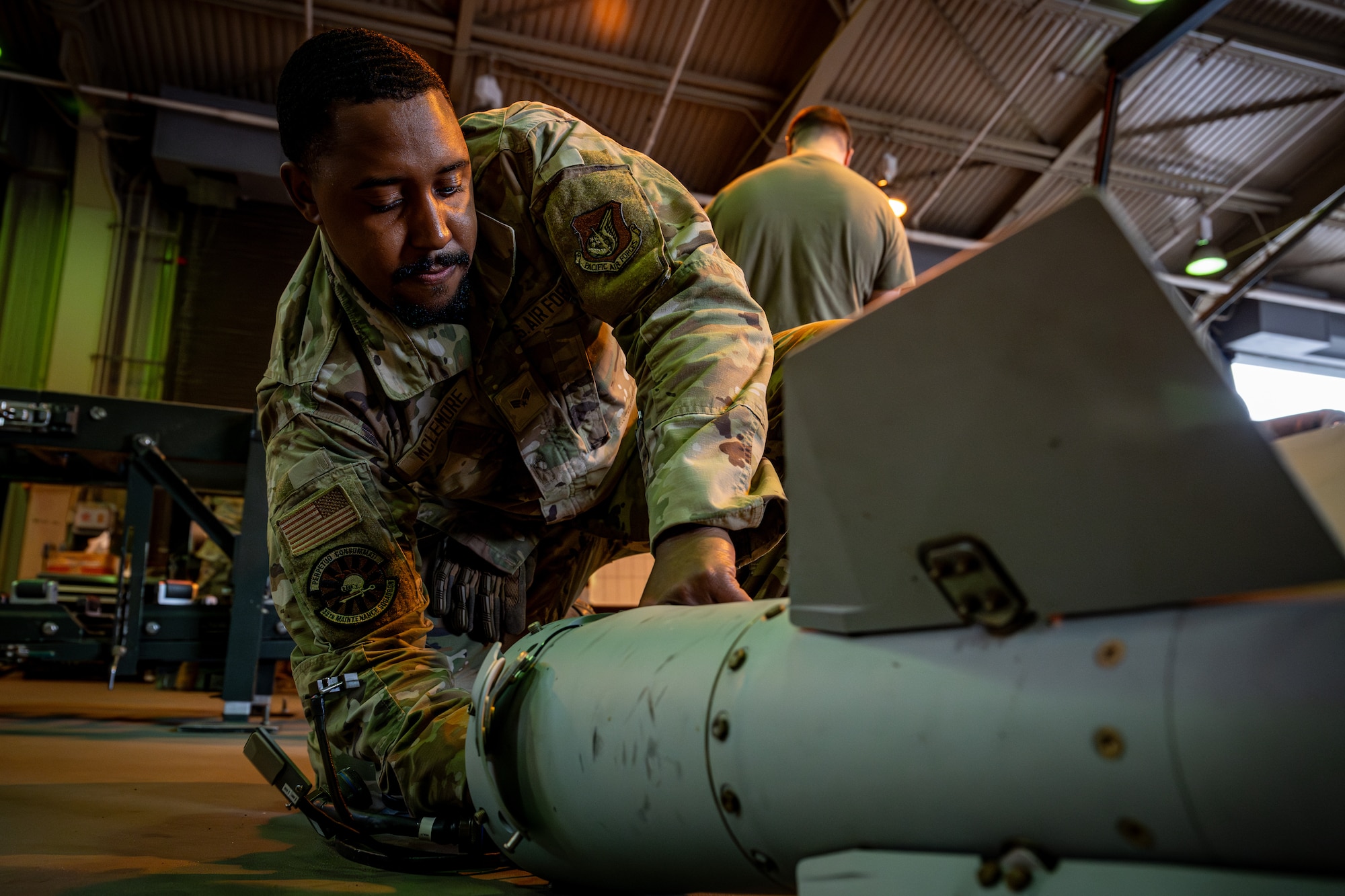 Airman fuses a bomb tail