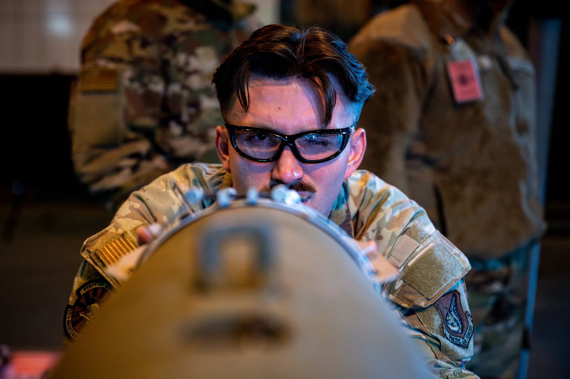 Airman check an alignment pin