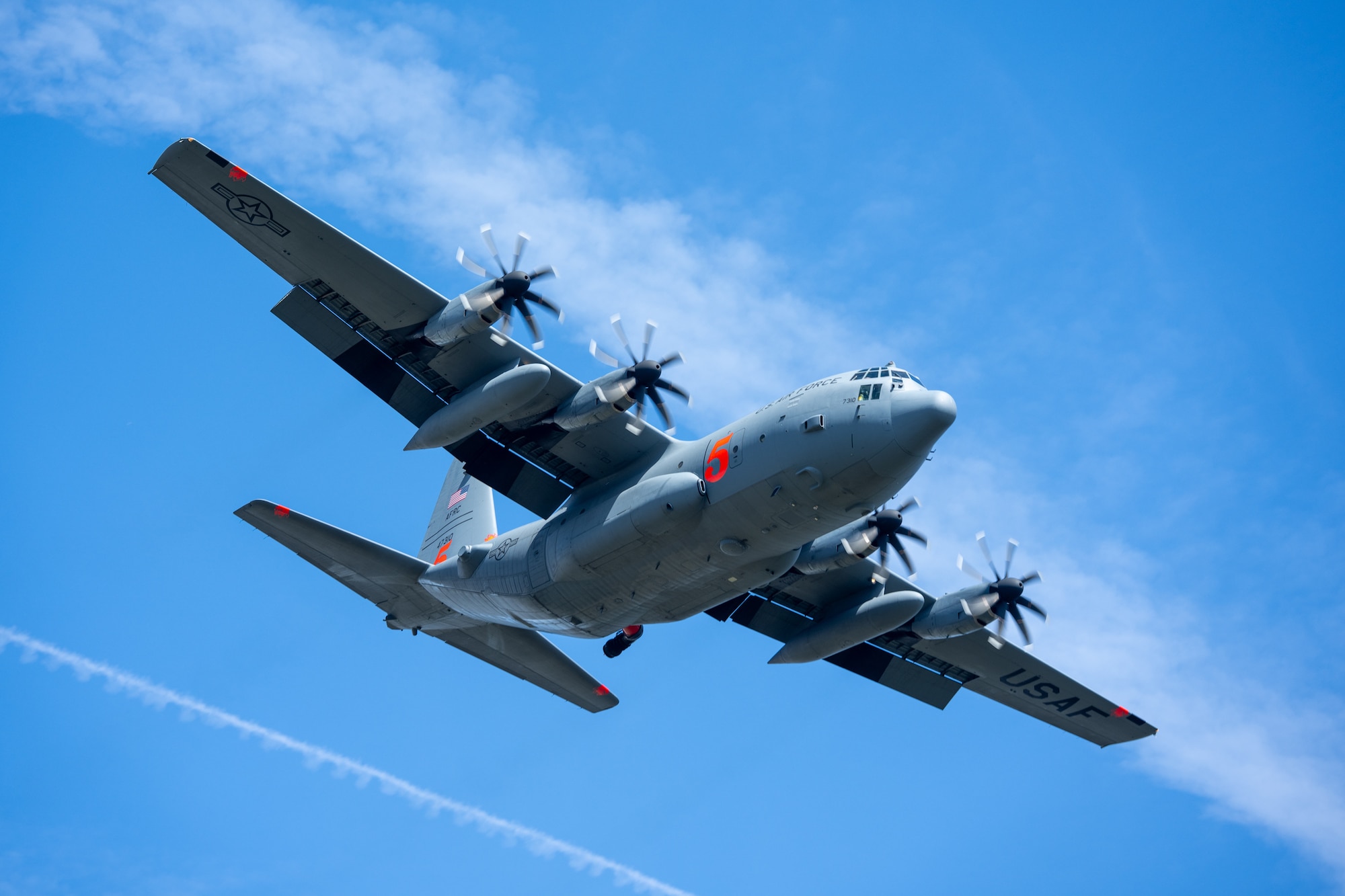 A C-130 (MAFFS 5) from the United States Air Force Reserve's 302nd Airlift Wing out of Colorado Space Force Base does a dry run before performing a water drop April 24, 2025