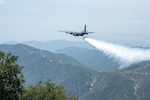 A C-130 (MAFFS 9) from Nevada Air National Guard's 152nd Airlift Wing performs a water drop April 24, 2025, during Modular Airborne Fire Fighting System (MAFFS) Spring Training 2025, hosted by the California Air National Guard's 146th Airlift Wing.