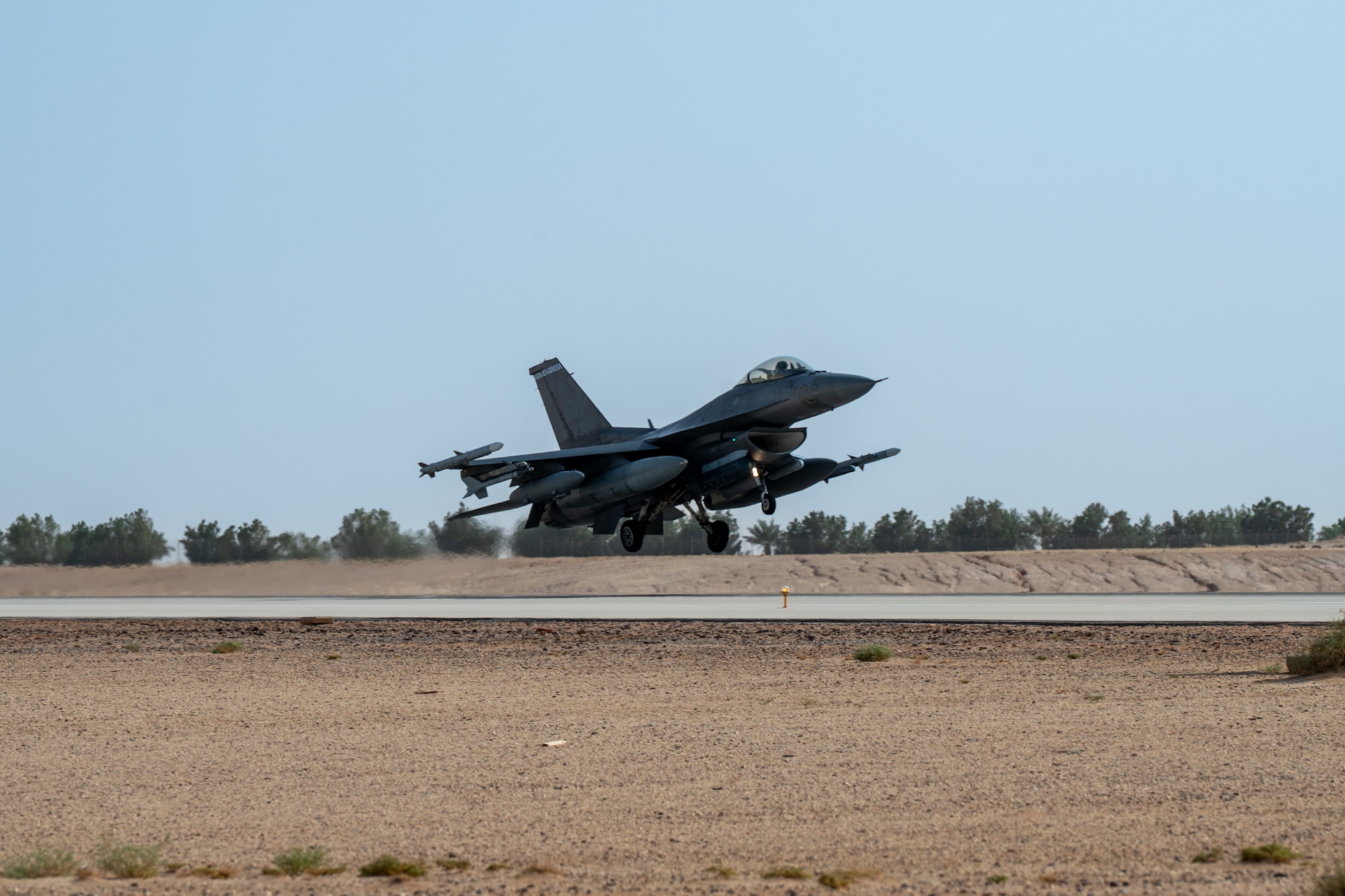 An F-16 lands on a runway