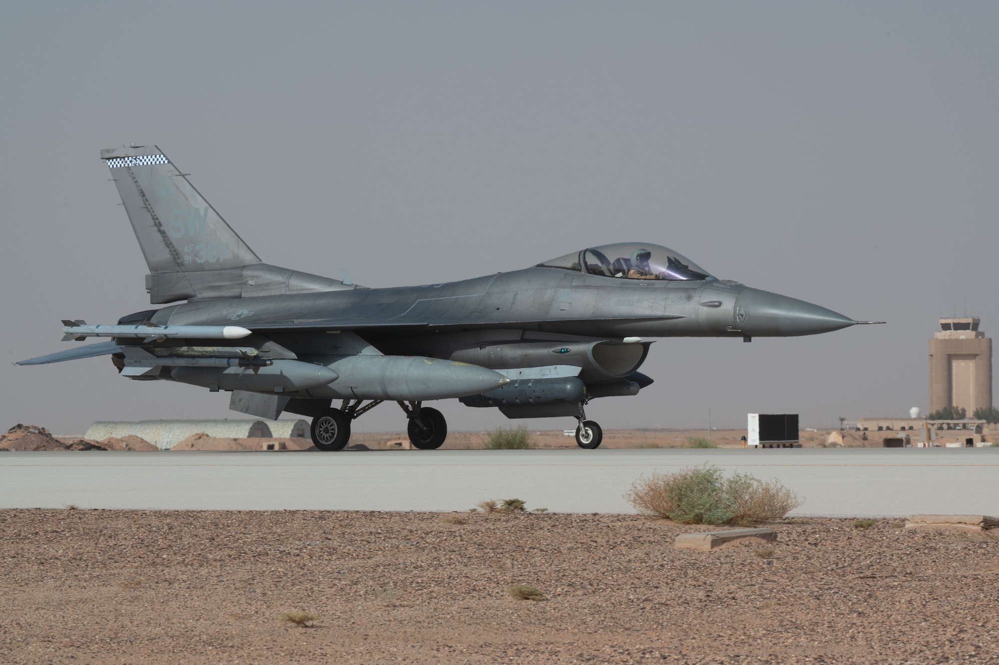An F-16 taxis on a runway