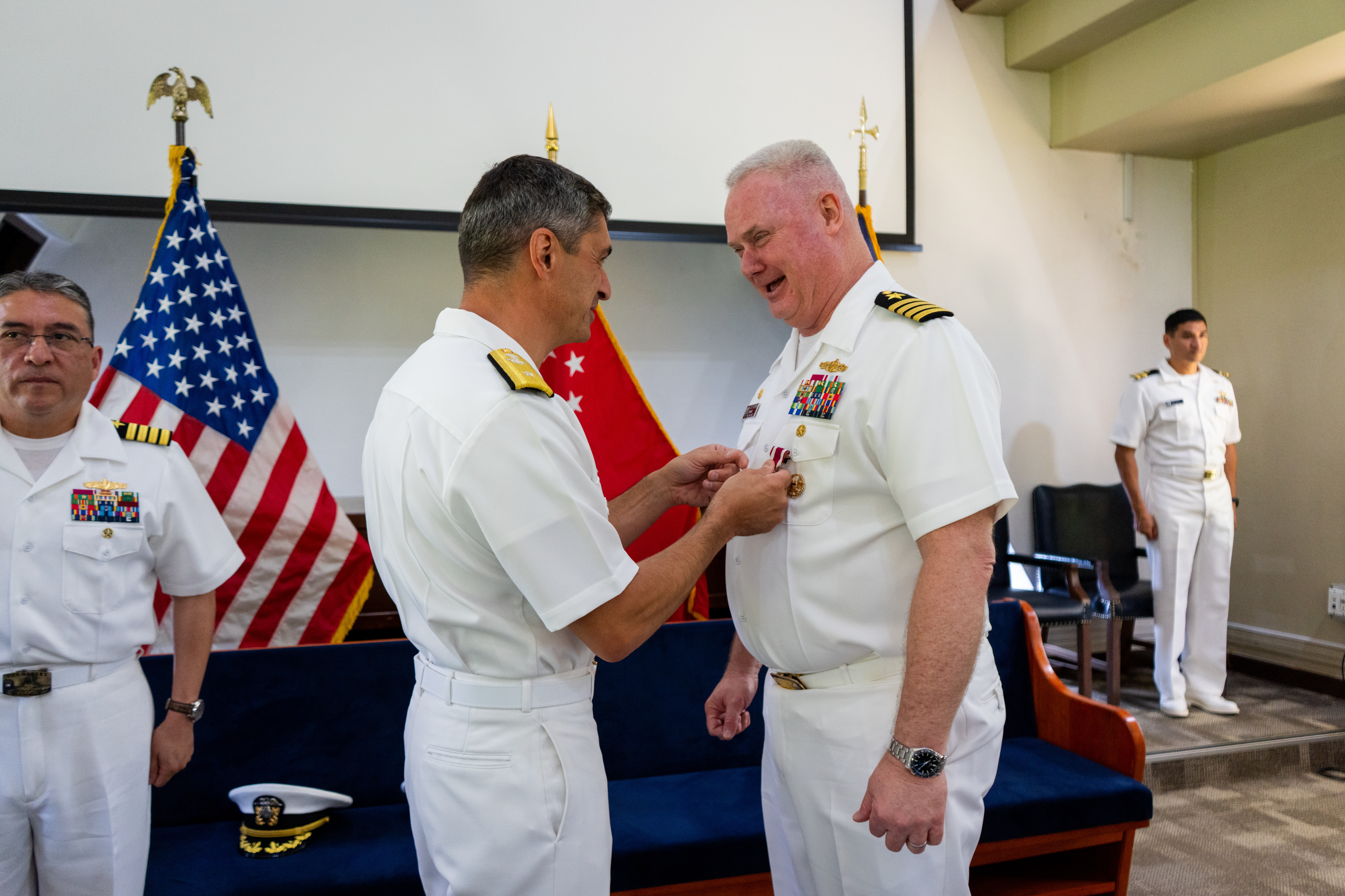 Rear Adm. Todd F. Cimicata, Commander, Logistics Group Western Pacific/ Task Force 73, presents Capt. Robert R. Williams, outgoing commander, Military Sealift Command Far East, with the Legion of Merit medal during a change of command ceremony at the Singapore Naval Installation in Sembawang, April 30, 2025, recognizing his achievements over the past two and a half years as Commodore of MSC Far East.