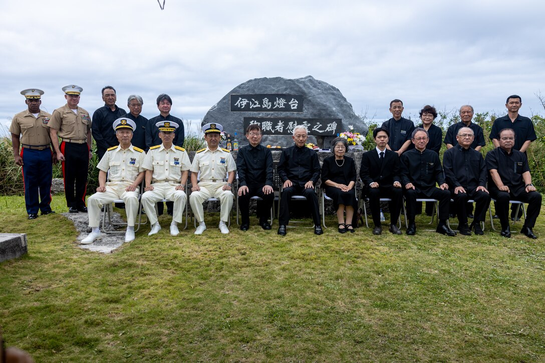 U.S. Marines, members of the Japanese Coast Guard, and members of the Okinawan Prefectural Government, pose for a group photo during the annual Ie Shima Lighthouse Memorial Service on Ie Shima, Okinawa, Japan, April 21, 2025. The memorial service was held to commemorate the casualties of World War II, the Ie Shima lighthouse keeper, and his family. (U.S. Marine Corps photo by Lance Cpl. Brody Robertson)