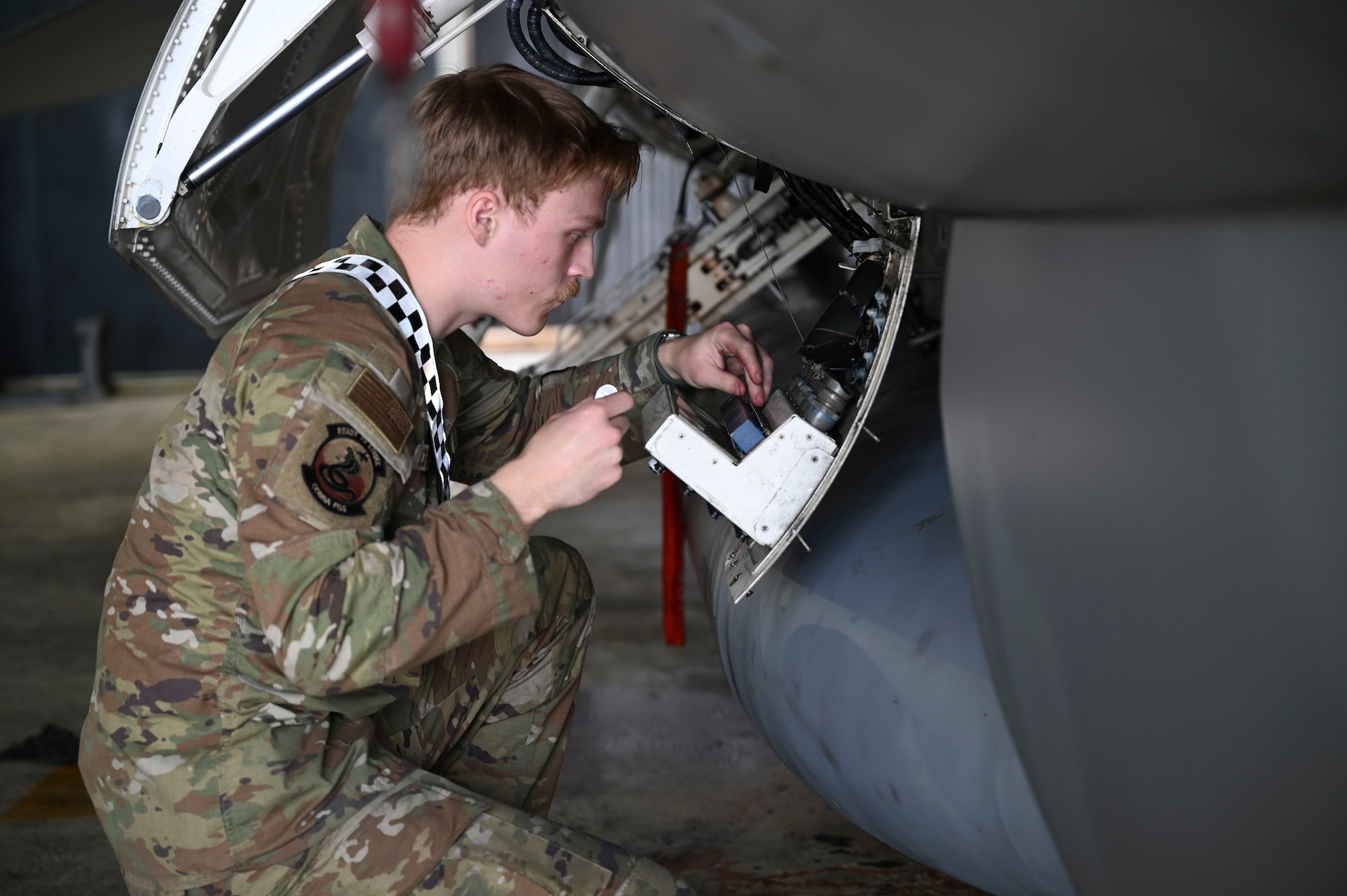 Senior Airman Zachary Christian, 35th Fighter Generation Squadron fighter integrated avionics specialist, performs maintenance on an F-16 Fighting Falcon aircraft during Freedom Flag 25-1 at Kunsan Air Base, Republic of Korea, April 23, 2025.