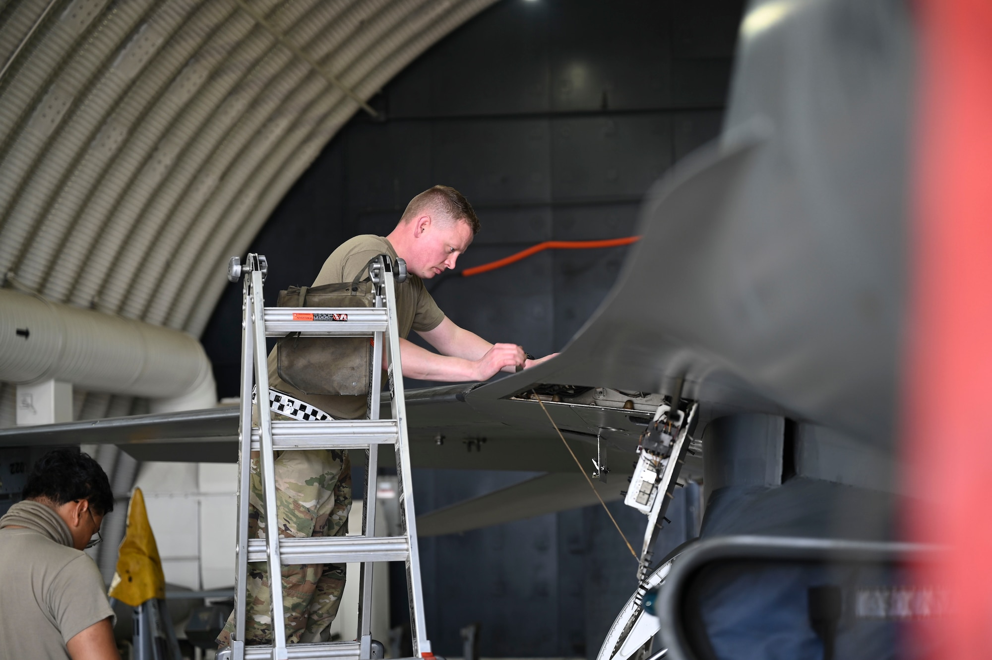 U.S. Air Force Tech. Sgt. Craig Gazette, 35th Fighter Generation Squadron environmental and electrical craftsman, opens a panel on an F-16 Fighting Falcon aircraft during Freedom Flag 25-1 at Kunsan Air Base, Republic of Korea, April 23, 2025.