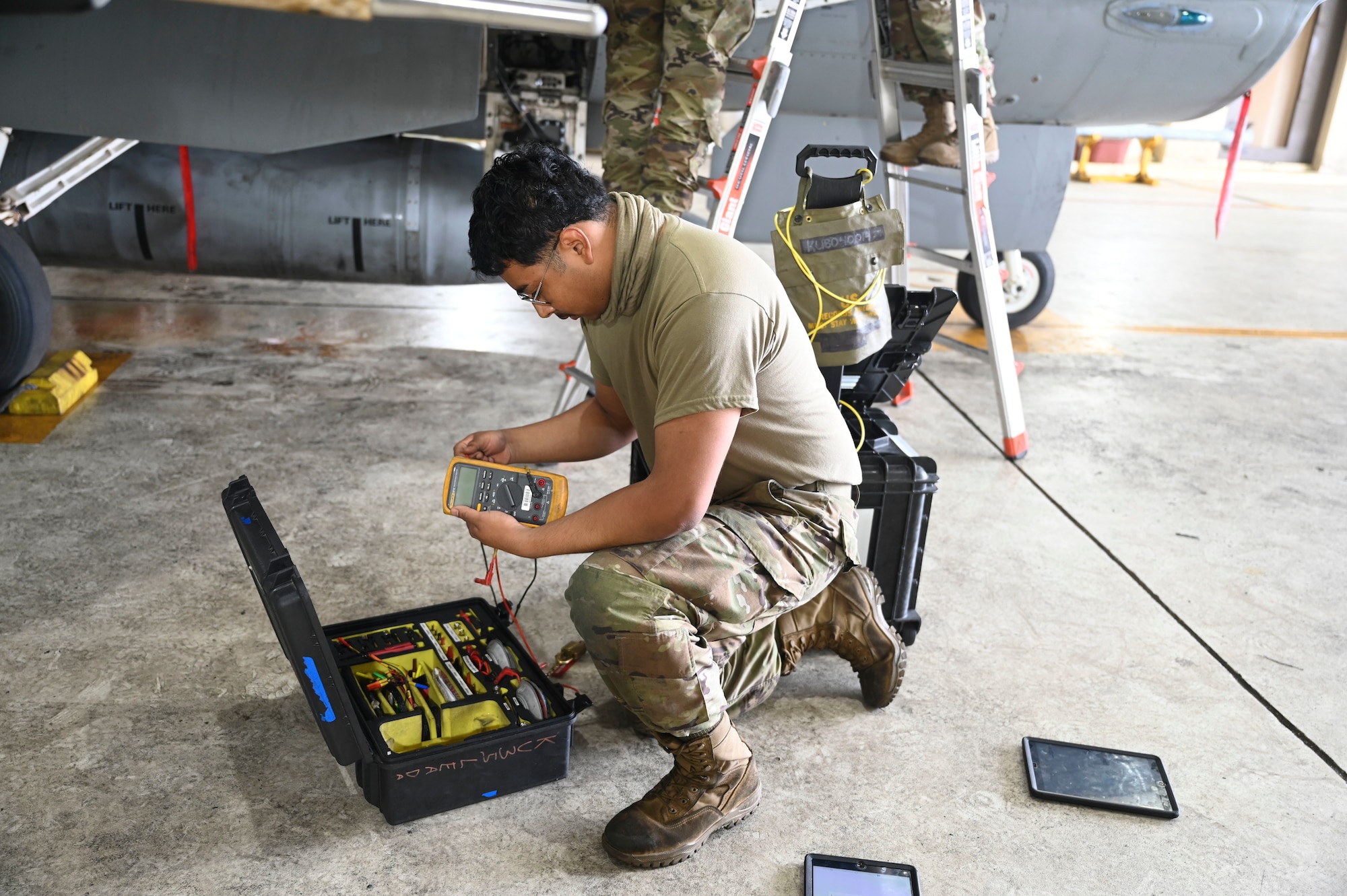 U.S. Air Force Airman Jose Galindo Barrios, 35th Fighter Generation Squadron environmental and electrical specialist, inspects maintenance equipment tools used on an F-16 Fighting Falcon aircraft during Freedom Flag 25-1 at Kunsan Air Base, Republic of Korea, April 23, 2025.