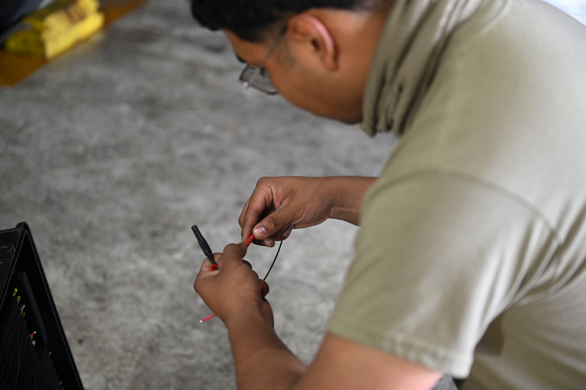 U.S. Air Force Airman Jose Galindo Barrios, 35th Fighter Generation Squadron environmental and electrical specialist, inspects maintenance equipment tools used to repair an F-16 Fighting Falcon aircraft during Freedom Flag 25-1 at Kunsan Air Base, Republic of Korea, April 23, 2025.