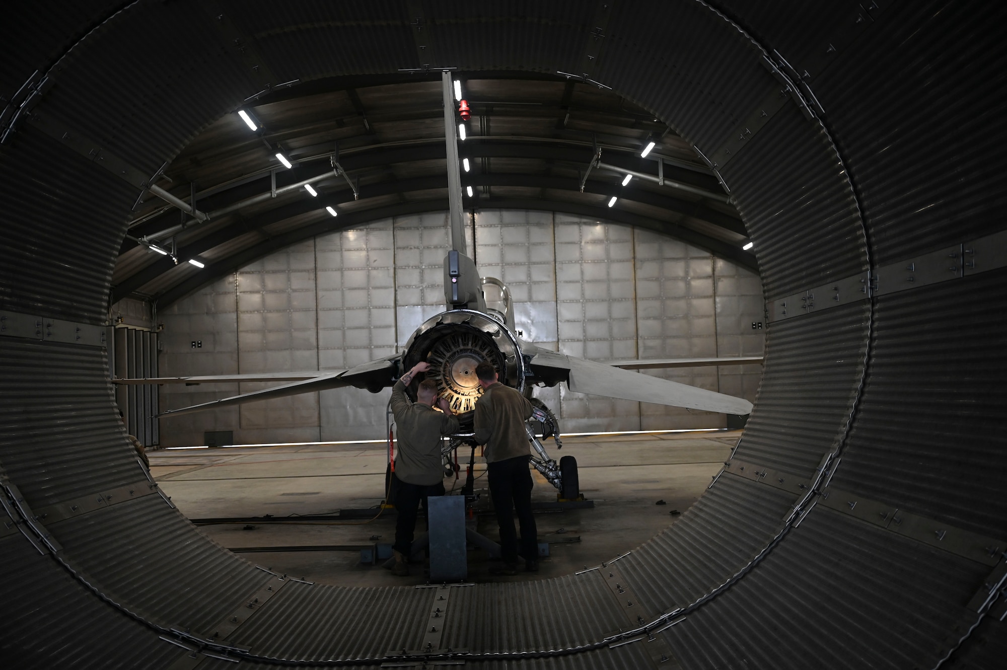U.S. Air Force Senior Airman Jake Breakfield, 8th Maintenance Squadron inspection section crew chief, inspects the exhaust of an F-16 Fighting Falcon aircraft during Freedom Flag 25-1 at Kunsan Air Base, Republic of Korea, April 23, 2025.