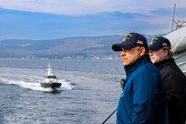 Command Master Chief Sergio Gonzalez, left, and Chief Sonar Technician (Surface) Emily Chandler observe an approaching pilot boat during a sea-and-anchor evolution aboard the Arleigh Burke-class guided-missile destroyer USS Bulkeley (DDG 84), April 25, 2025.