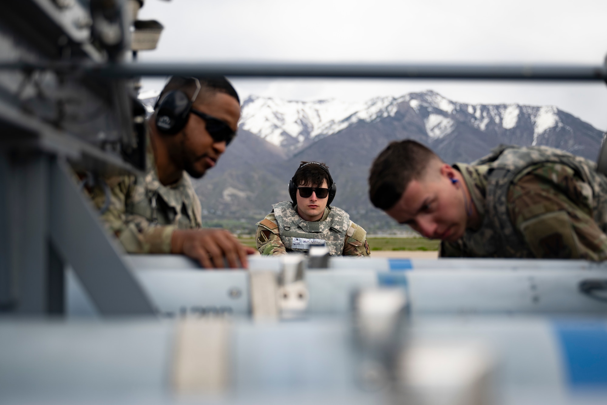 A photo of Airmen loading weapons into an F-35