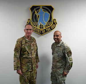 U.S. Air Force Lieutenant General John Healy, Chief of the Air Force Reserve and Commander of Air Force Reserve Command, and Chief Master Sergeant Israel Nuñez, Senior Enlisted Advisor to the Chief of the Air Force Reserve, pose for a photo in front of the historic 960th Cyberspace Wing ’Gladiators of the Grid’ unit emblem at Joint Base San Antonio-Lackland, Texas on April 6, 2025. The command team’s visit to the headquarters provided deeper understanding of the cyber mission and the Citizen Airmen working to ensure a more lethal and effective force. (US Air Force photo by 1st Lt Alex Dieguez)
