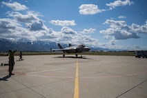 A photo of Airmen marshaling an F-35 on the flight line at Hill Air Force Base, Utah
