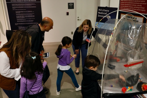 SILVER SPRING, Md. (25 April, 2025) Dr. Jill Phan, Naval Medical Research Command (NMRC) science director, explains technology used by the command to conduct research on behalf of service members to visitors at the National Museum of Health and Science’s Military Medical Innovation event. NMRC, headquarters of Navy Medicine Research & Development, is engaged in a broad spectrum of activity from basic science in the laboratory to field studies in austere and remote areas of the world to investigations in operational environments. In support of Navy, Marine Corps and joint U.S. warfighter health, readiness and lethality, researchers study infectious diseases, biological warfare detection and defense, combat casualty care, environmental health concerns, aerospace and undersea medicine, operational mission support and epidemiology. For 250 years, Navy Medicine, represented by more than 44,000 highly-trained military and civilian healthcare professionals, has delivered quality healthcare and enduring expeditionary medical support to the warfighter on, below, and above the sea and ashore. (U.S. Navy photo by Sidney Hinds /Released)
