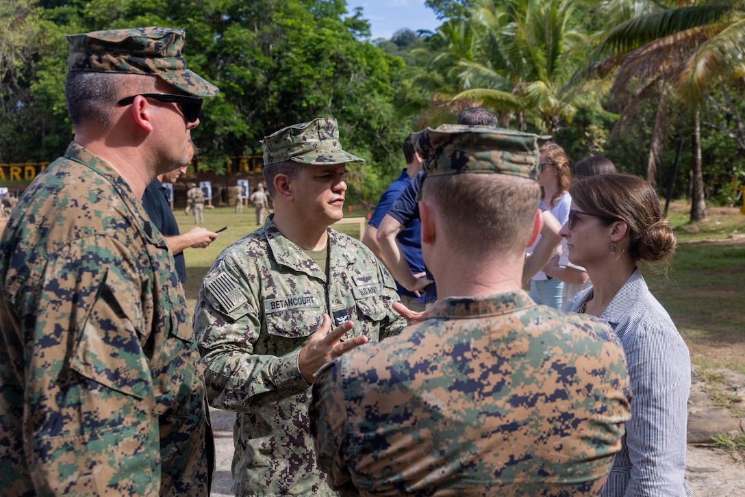 Capt. Daniel Betancourt, Senior Defense Official with the United States Embassy in Panama, speaks to professional staff members of the Senate Armed Services Committee and United States Marines about Department of Defense security cooperation efforts in Horoko, Panama, April. Senate Armed Services Committee Professional Staff Members visited United States Marines conducting bilateral subject matter exchanges with Servicio Nacional Aeronaval (SENAN) to better understand ongoing security cooperation initiatives as part of expanded partnerships between the United States and Panama. (U.S. Marine Corps photo by Lance Cpl. Francis Hrosar)