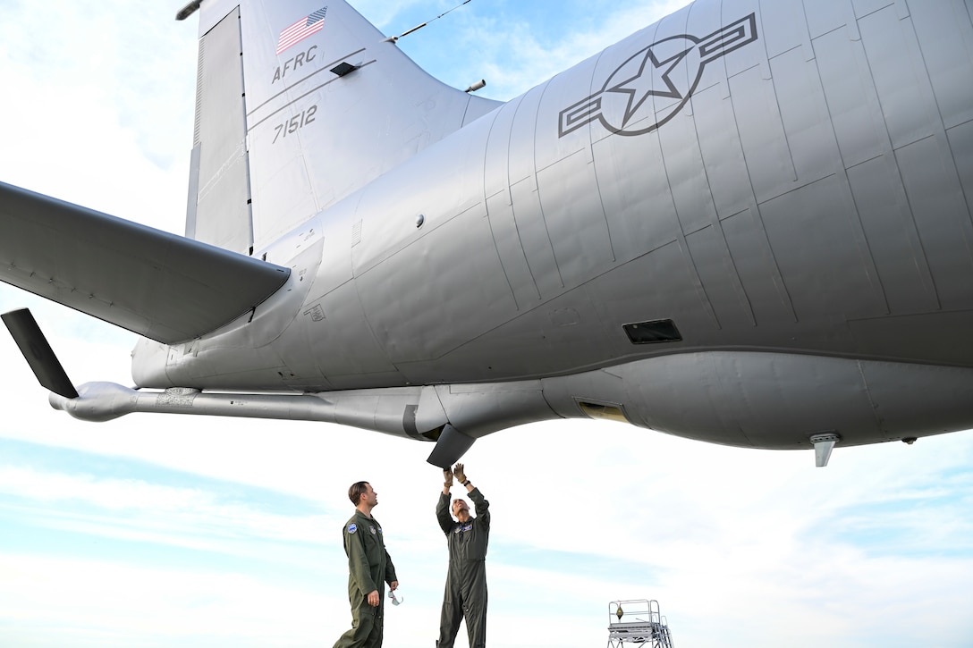 U.S. Air Force Maj. James Scott Malcolm and Maj. Alexandre Beaussart, both pilots assigned to the 756th Air Refueling Squadron, conduct a preflight inspection of a KC-135 Stratotanker at Joint Base Andrews, Md., April 22, 2025. The 459th ARW provides critical air refueling support worldwide as part of Air Force Reserve Command. (U.S. Air Force photo by Senior Airman Gianluca Ciccopiedi)
