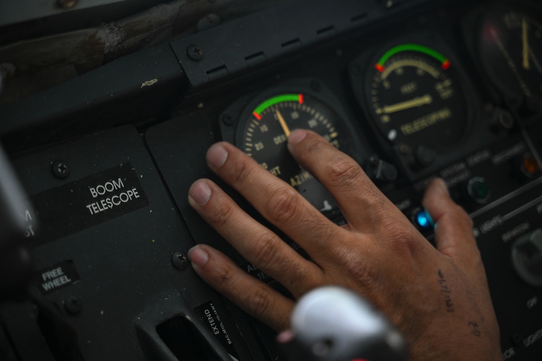 U.S. Air Force Staff Sgt. Elisaul Penafiel Alvarez, a boom operator assigned to the 756th Air Refueling Squadron, checks KC-135 Stratotanker instruments during a refueling mission, April 22, 2025. Boom operators are responsible for safely delivering fuel to a wide range of U.S. and allied aircraft mid-flight. (U.S. Air Force photo by Senior Airman Gianluca Ciccopiedi)