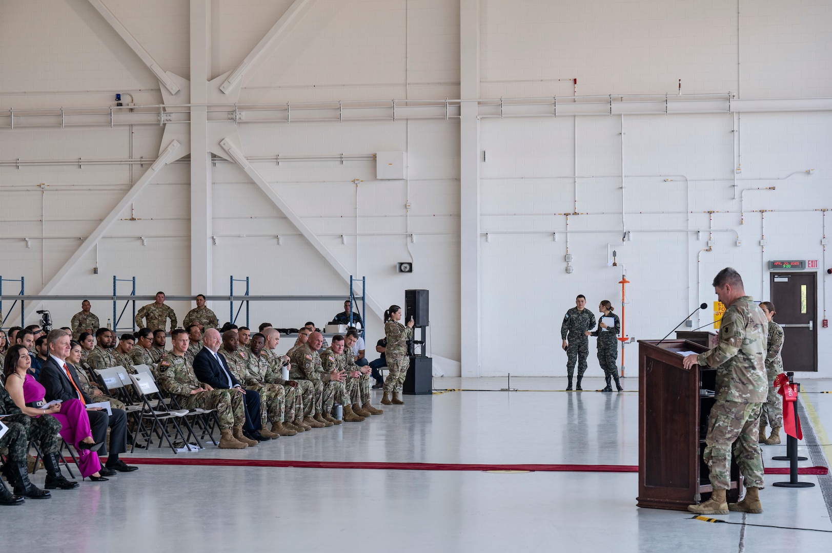 Maj. Gen. Phillip Ryan delivers remarks to a crowd at the hangar ceremony dedication on Soto Cano AB.