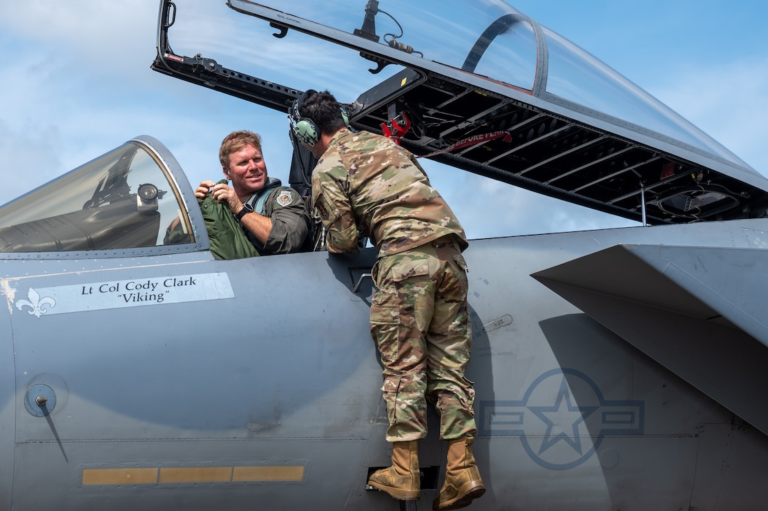 U.S. Air Force Col. David Anderson, 159th Fighter Wing commander, talks to Tech. Sgt. Josh Bravo, F-15C Eagle crew chief from the 159th Aircraft Maintenance Squadron, after landing at Chennault International Airport in Lake Charles, La., April 29, 2025. The 159th Fighter Wing worked with leadership from the 2nd Bomb Wing to train together and build a greater working relationship. (U.S. Air Force photo by Senior Airman Seth Watson)