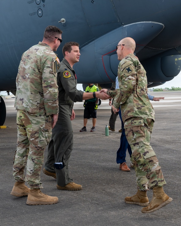 U.S Air Force Lt. Col. Matthew Dougherty, 96th Bomb Squadron commander, greets Lt. Col. Stephen Luebbert,  Louisiana Army National Guard Global Force Information Management Operations branch chief, after landing at Chennault International Airport in Lake Charles, La., April 29, 2025. The visit was part of a joint integration effort between the 2nd Bomb Wing, 159th Fighter Wing, and the Louisiana Army National Guard to strengthen interoperability and explore future operational opportunities at Chennault International Airport. (U.S. Air Force photo by Senior Airman Seth Watson)