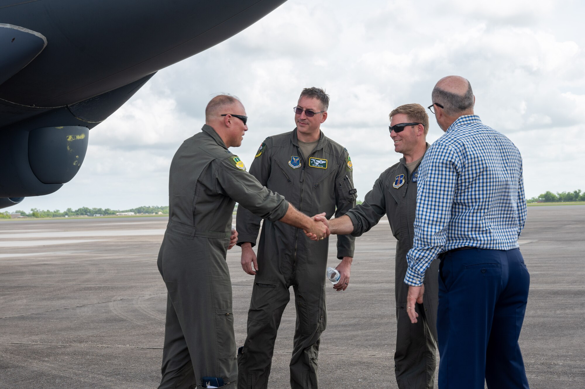 U.S. Air Force Col. Michael Maginness, 2nd Bomb Wing commander, greets Col. David Anderson, 159th Fighter Wing commander, after landing at Chennault International Airport in Lake Charles, La., April 29, 2025. Leadership from the 2nd Bomb Wing and 159th Fighter Wing conducted tactical training together and toured the local facilities to assess how the units could utilize the facilities for future training.  (U.S. Air Force photo by Senior Airman Seth Watson)